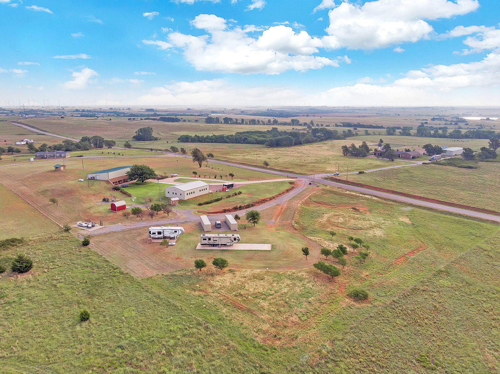 LARGE COUNTRY HOME ON ACREAGE WITH MULTIPLE SHOPS